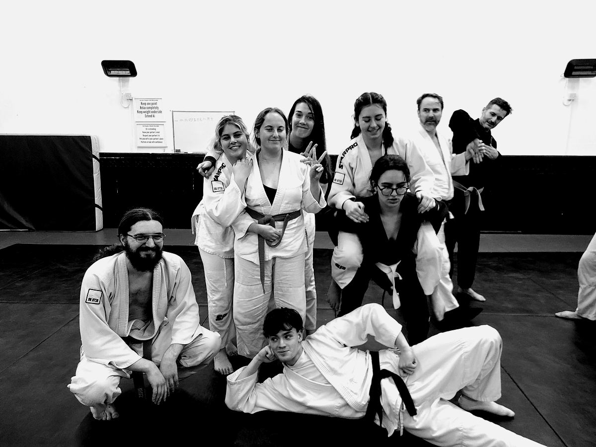 Club members of different grades lined up after a session