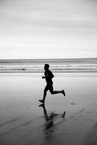 free-photo-of-man-running-along-beach